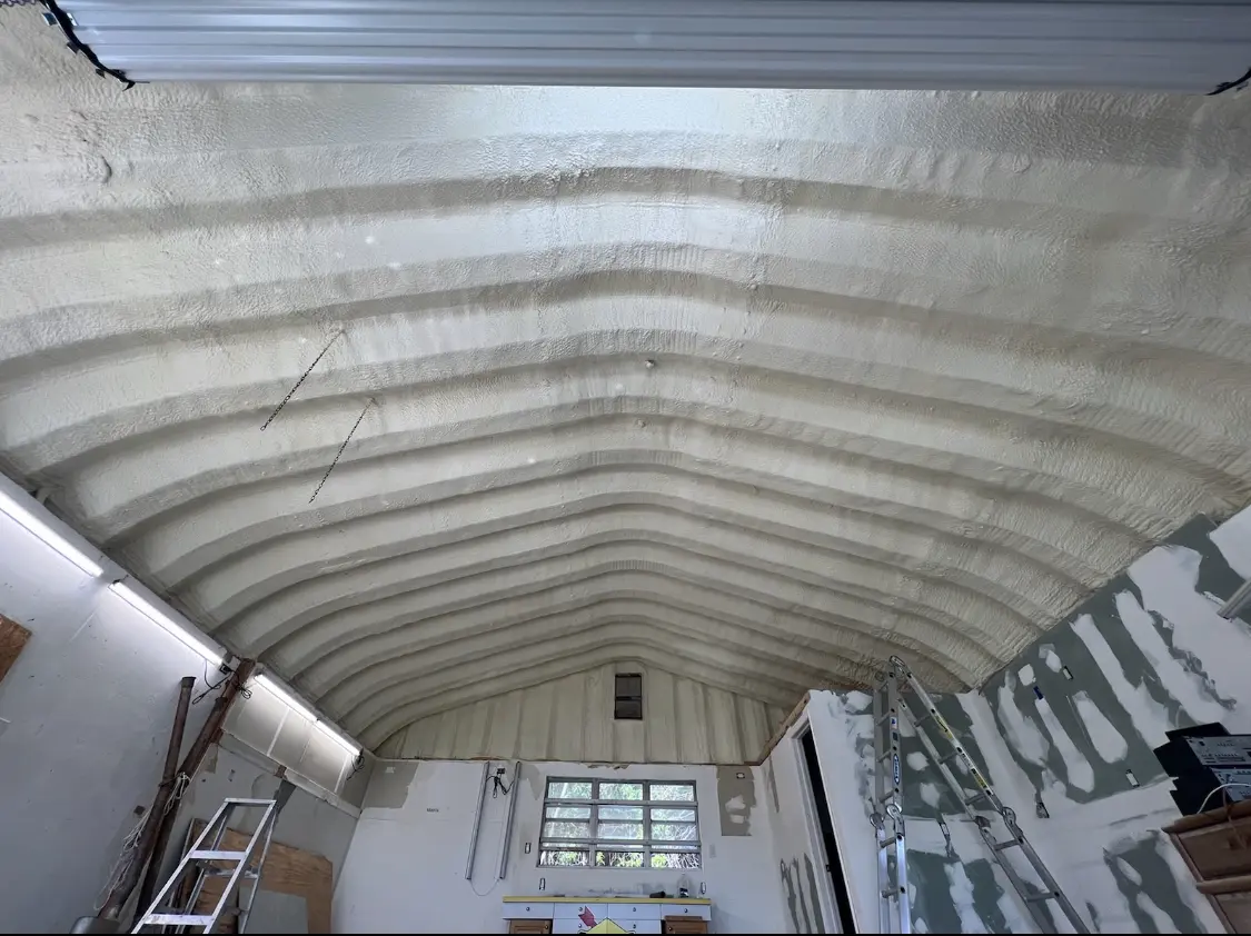Spray polyurethane foam applied to the underside of a metal roof deck in West Deer
